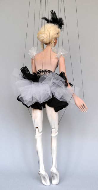 Wooden marionette in ballerina tutu