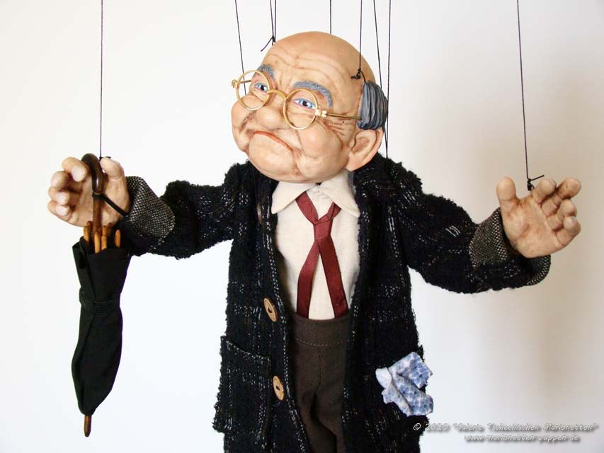 Old man deals hand puppet